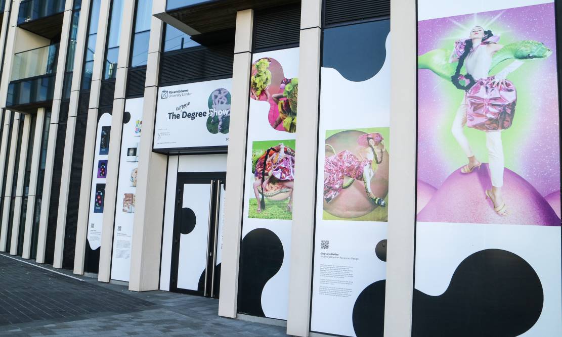 Students' work displayed on a building on Greenwich Peninsula