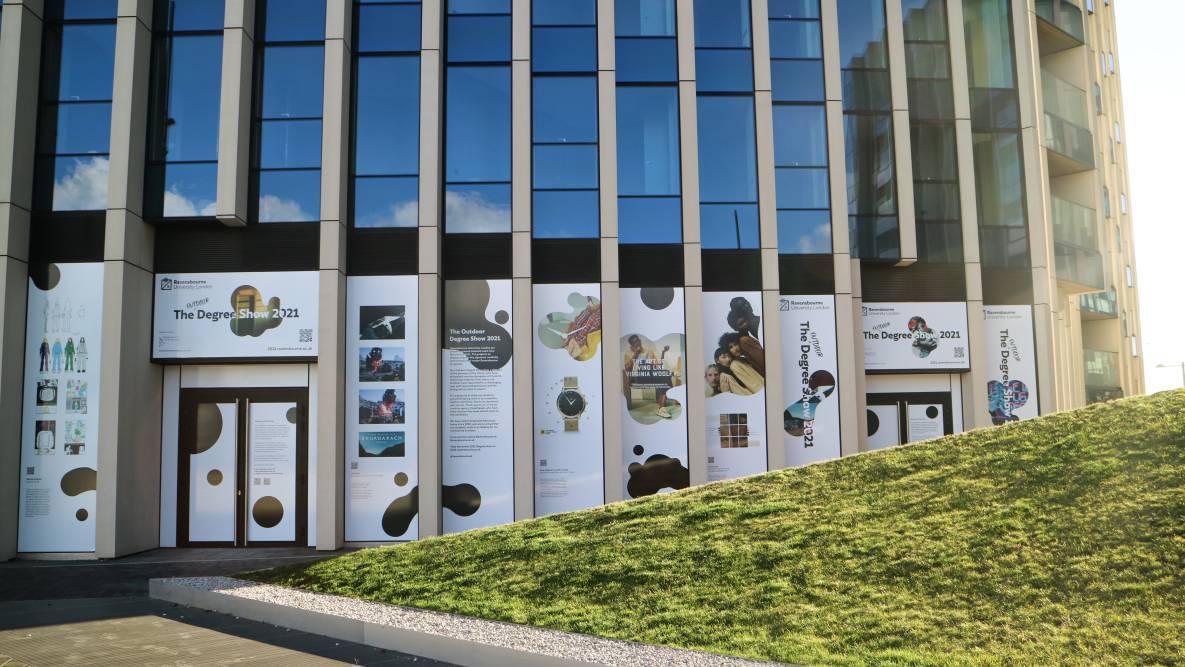 Students' work is displayed on the Ravensbourne building