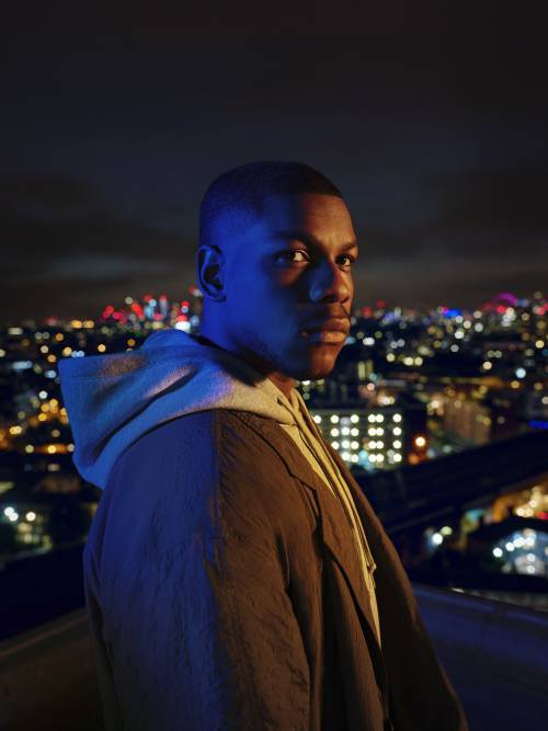 Actor John Boyega on a rooftop at night